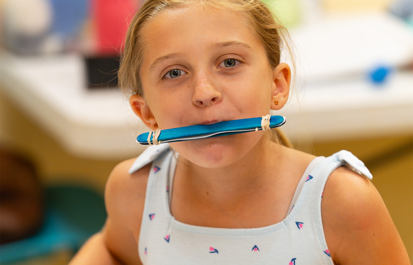 Mari playing harmonica (web)